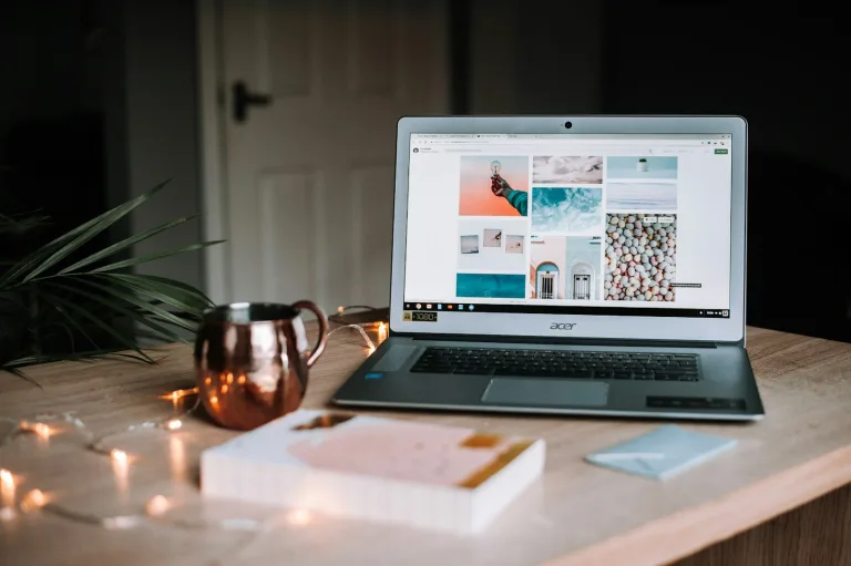 AI content creation workflow on a laptop at a writing desk