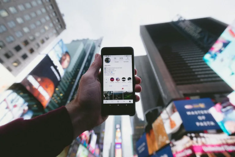 AI social media automation shown as content being reviewed on a phone