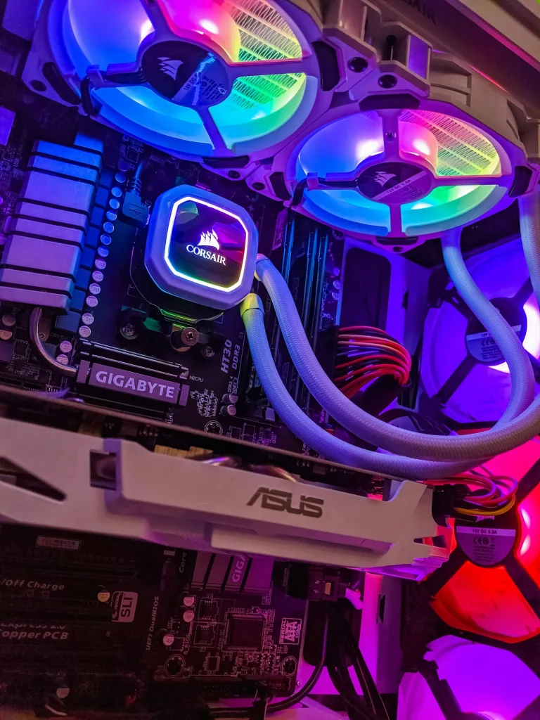 Mid range local AI build showing motherboard, cooling loop and graphics card