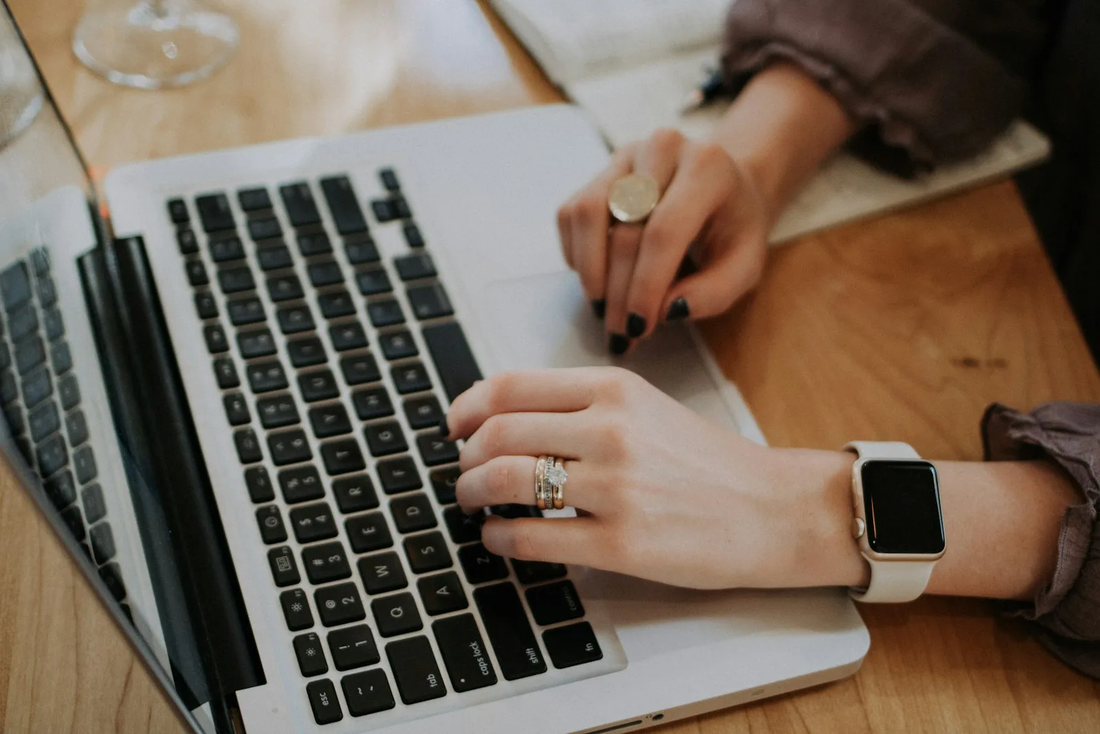 Writing a WordPress blog post with AI on a laptop keyboard